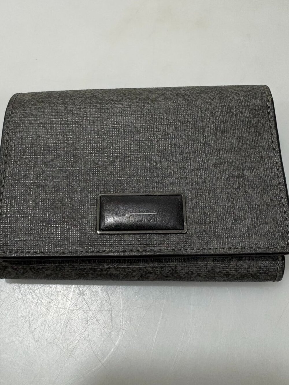 Tumi Sinclair Textured Earl Grey Leather Tri-Fold Wallet ID Window
